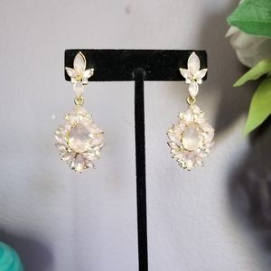 Baby pink colored stones with white crystal accent